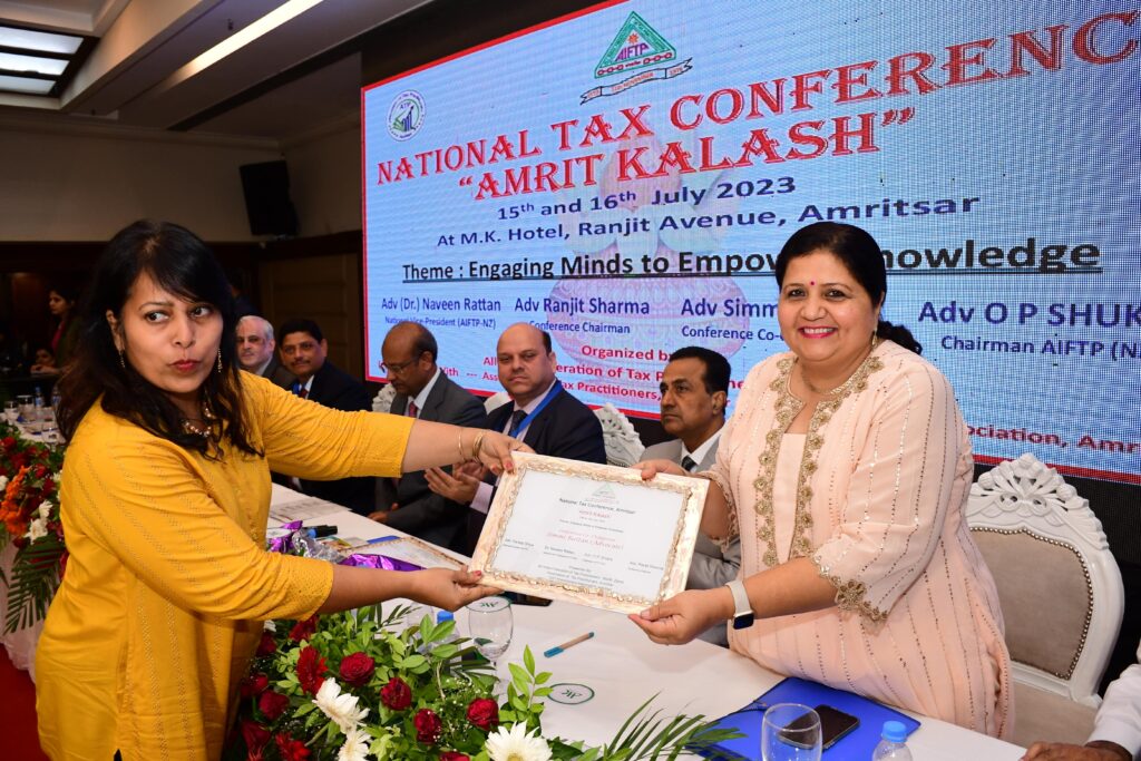 Receiving award in the presence of Hon'ble Judge Mr. Arun Palli NTC Amritsar, 2023.