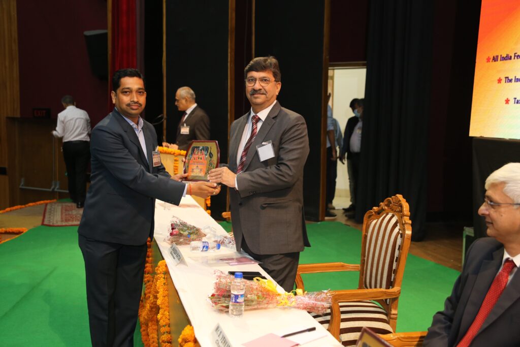 Receiving Momento at National Tax Conference at Jammu 2021